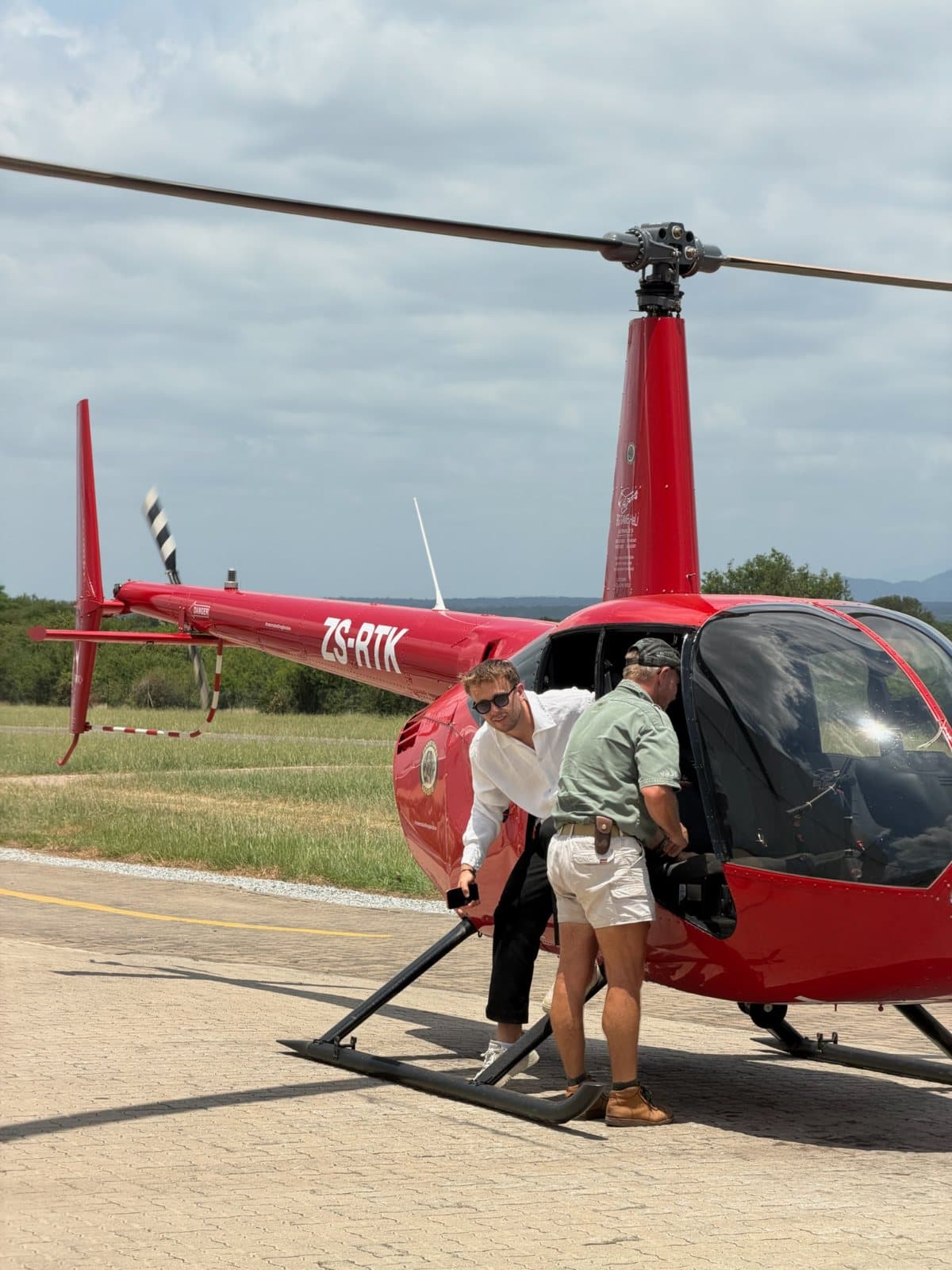 A red helicopter over the safari