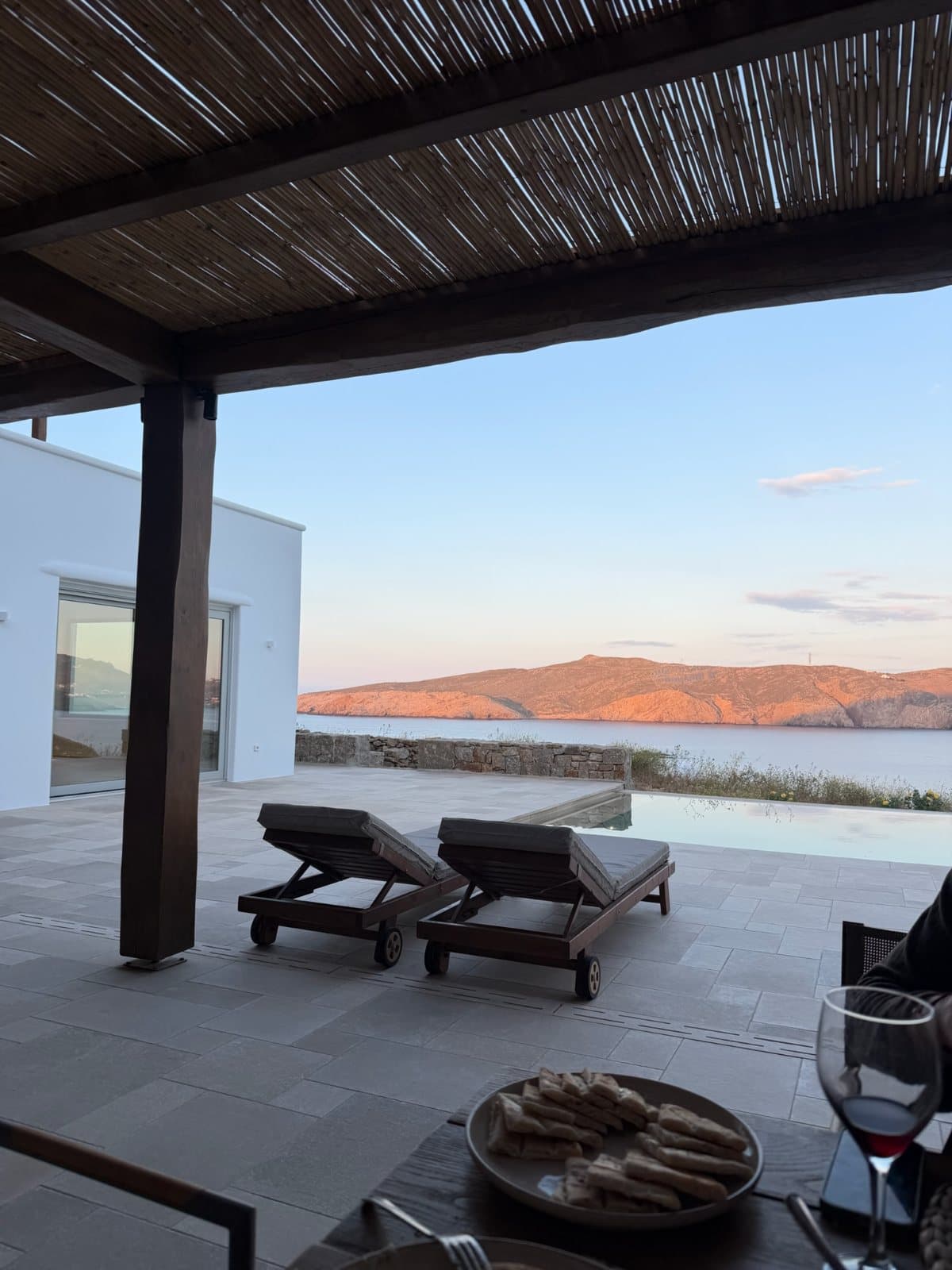 A terrace above the sea at dusk