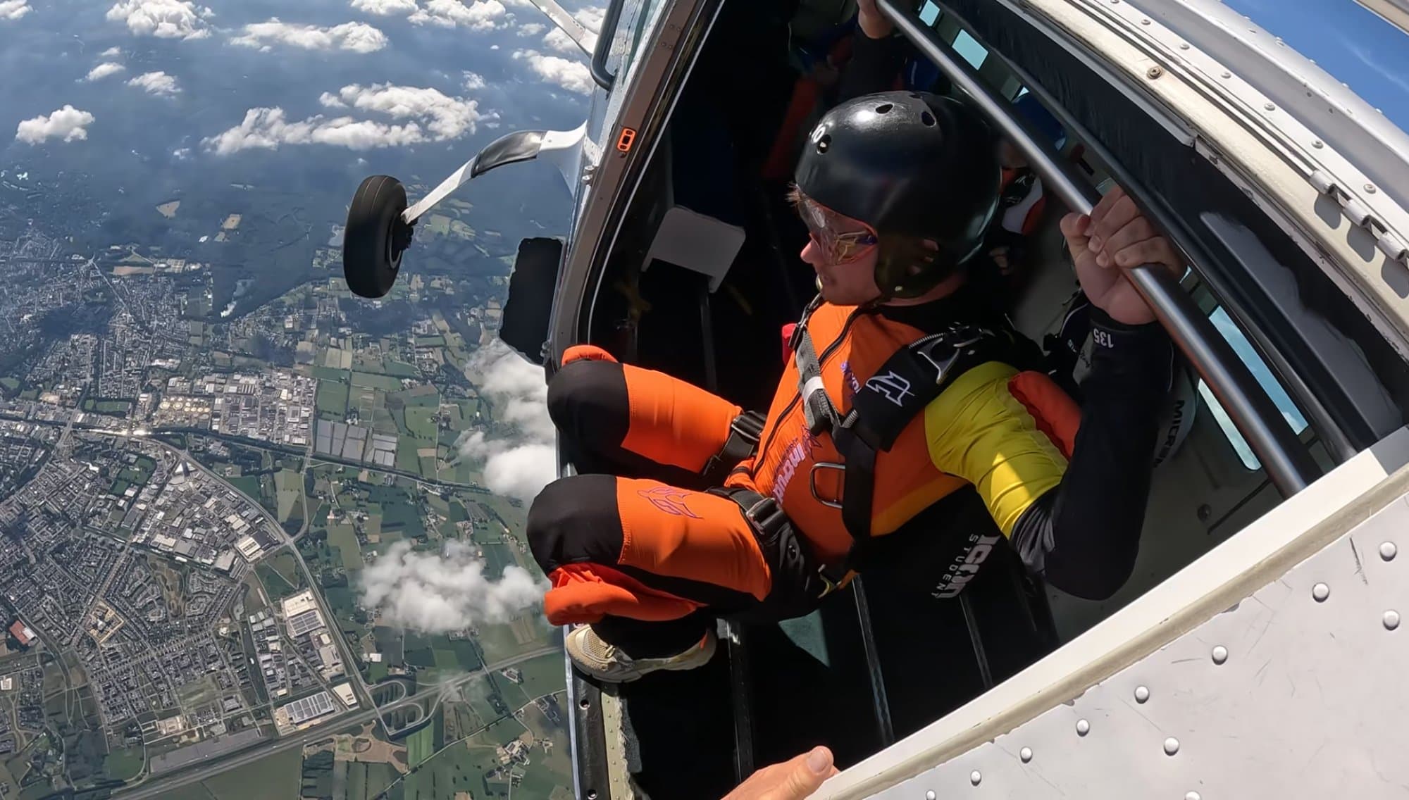 A founder at the open door before a skydive