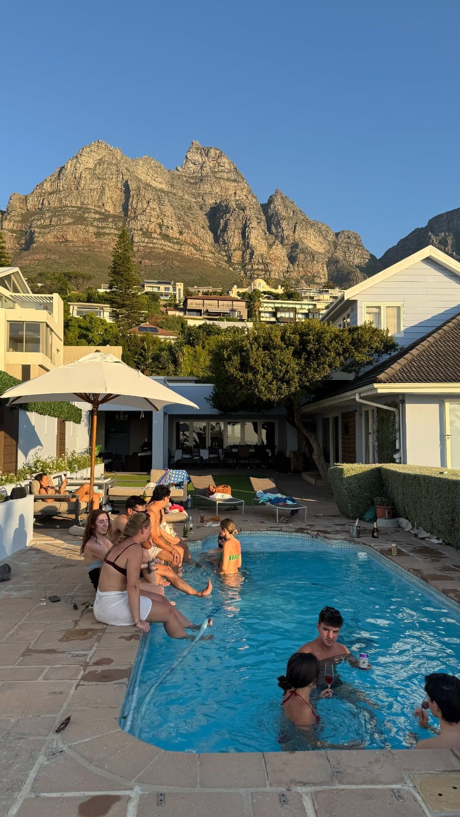 Friends in the pool below the mountain